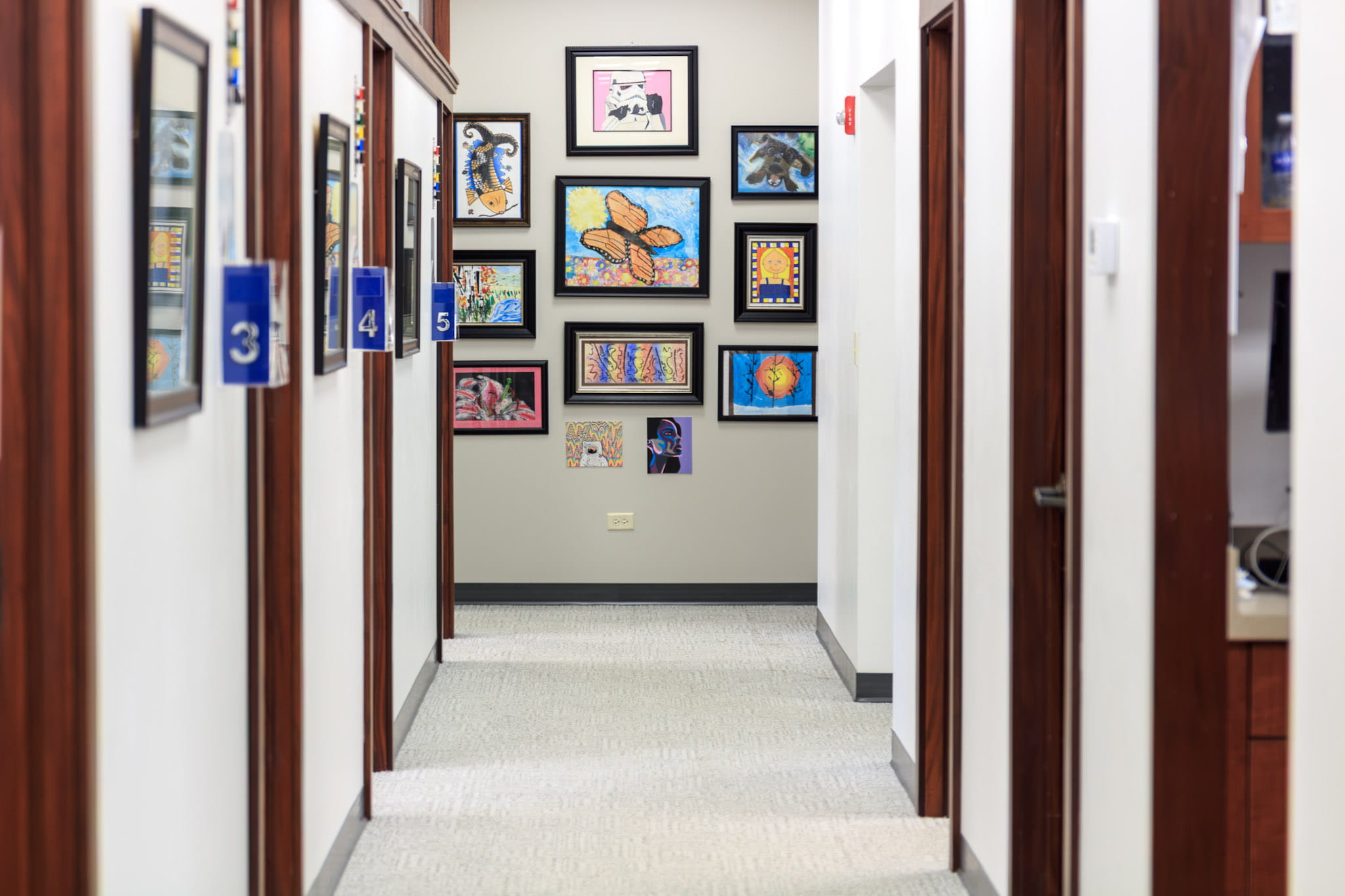 Framed degrees on wall at Wheaton Oral Surgery in Naperville, IL