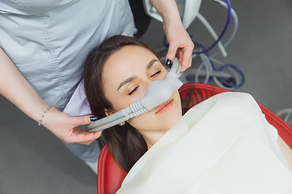 patient receiving nitrous oxide during a procedure at Wheaton Oral Surgery in Naperville, IL